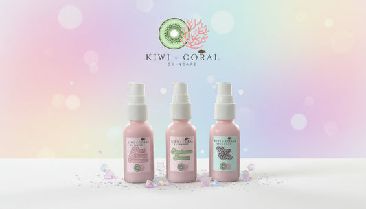 Kiwi and Coral Skincare Everyday Glow Trio — Kiwi Splash Cleanser, Sunbeam Serum, and Glow Whip Moisturizer in pink glass bottles with white pumps, displayed on a white surface with pastel gems and star accents, set against a soft gradient background. Clean, vegan skincare set for teens and sensitive skin to cleanse, hydrate, and glow.