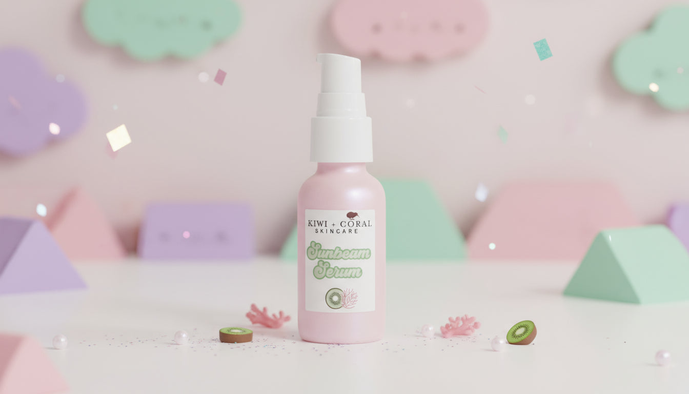 Kiwi and Coral Sunbeam Serum — pink glass bottle with white pump displayed with pastel colors, soft pearls, and a fresh teen-inspired vibe. Highlights: brightening, balancing serum with bakuchiol, vitamin C ferment, and sea buckthorn designed to smooth, hydrate, and give teen skin a healthy, radiant glow.